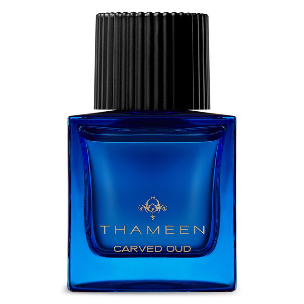 Thameen Carved Oud perfume in a blue glass bottle with black ribbed cap by Thameen London fragrance