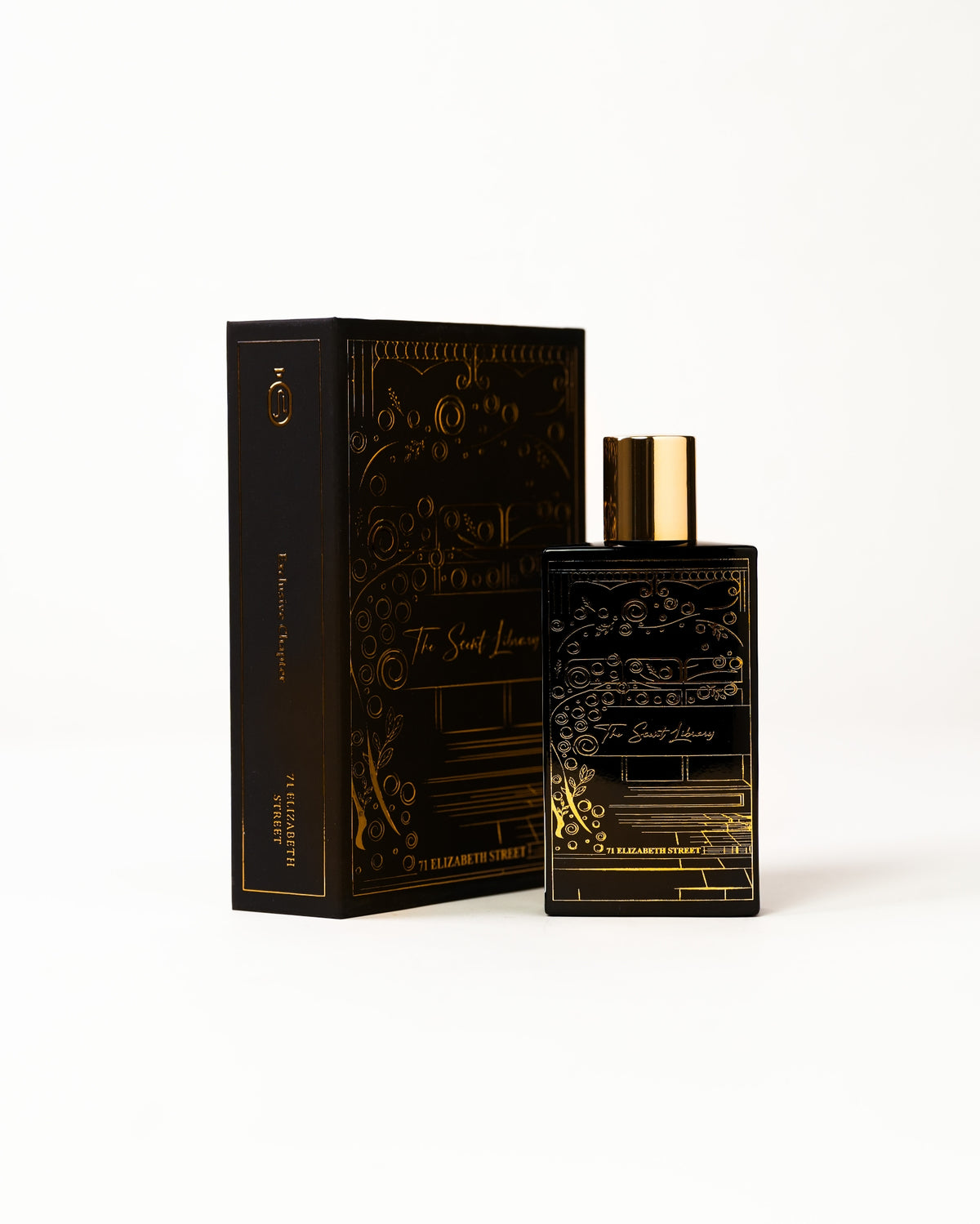 71 Elizabeth Street eau de parfum by The Scent Library, a black bottle with gold storefront artwork and a gold cap, alternate view