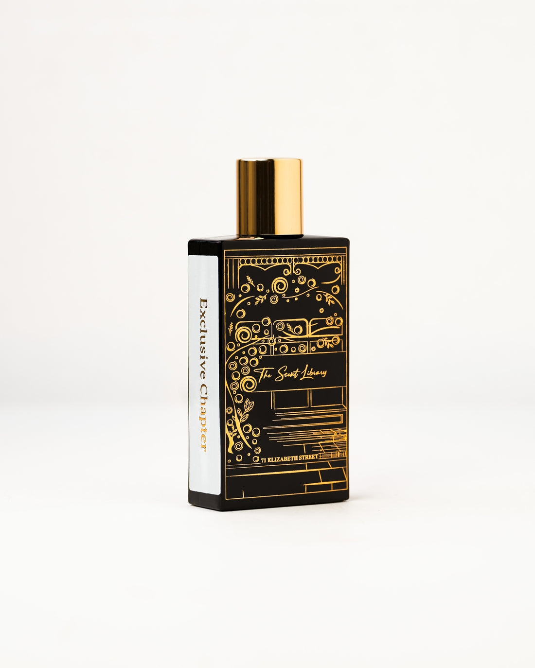 71 Elizabeth Street eau de parfum by The Scent Library, a black bottle with a gold cap and ornate gold line-art of a storefront, Exclusive Chapter side label