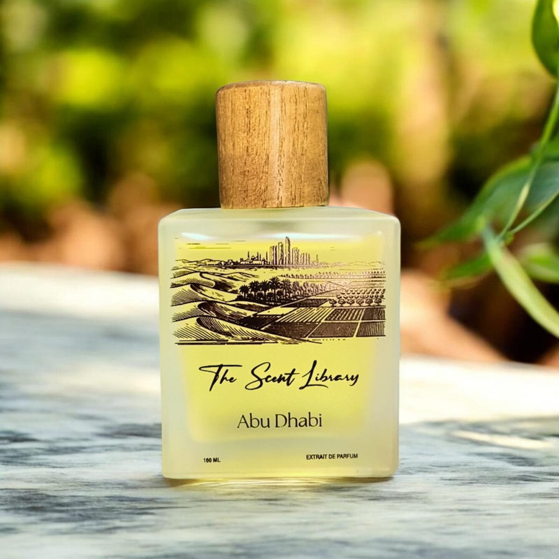 Abu Dhabi extrait de parfum by The Scent Library, a frosted glass bottle with a wooden cap and an illustrated label of the Abu Dhabi skyline, desert and palms