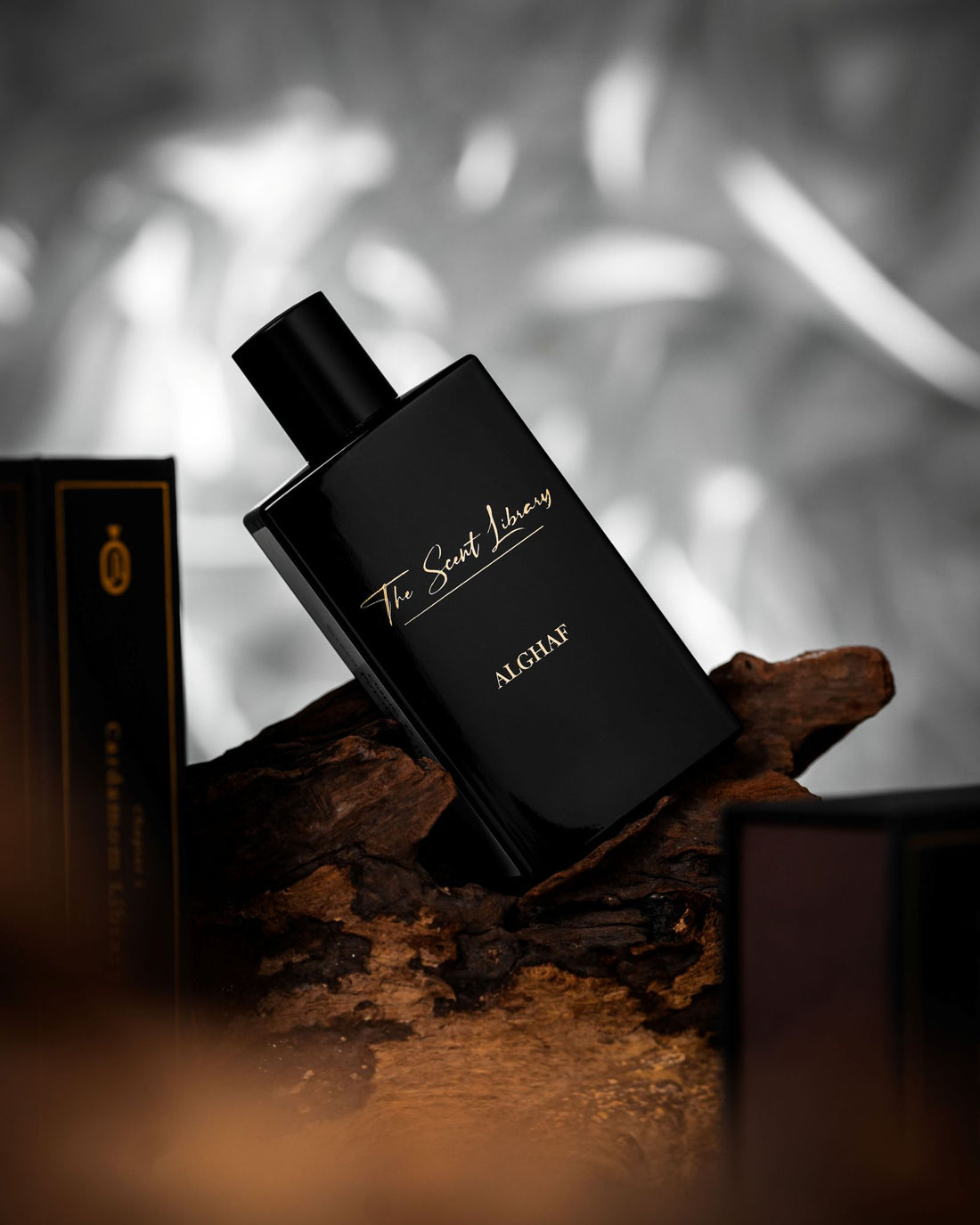Al Ghaf eau de parfum by The Scent Library, a glossy black rectangular bottle with gold lettering and a Chapter 13 Green Powdery Library side label, bestseller
