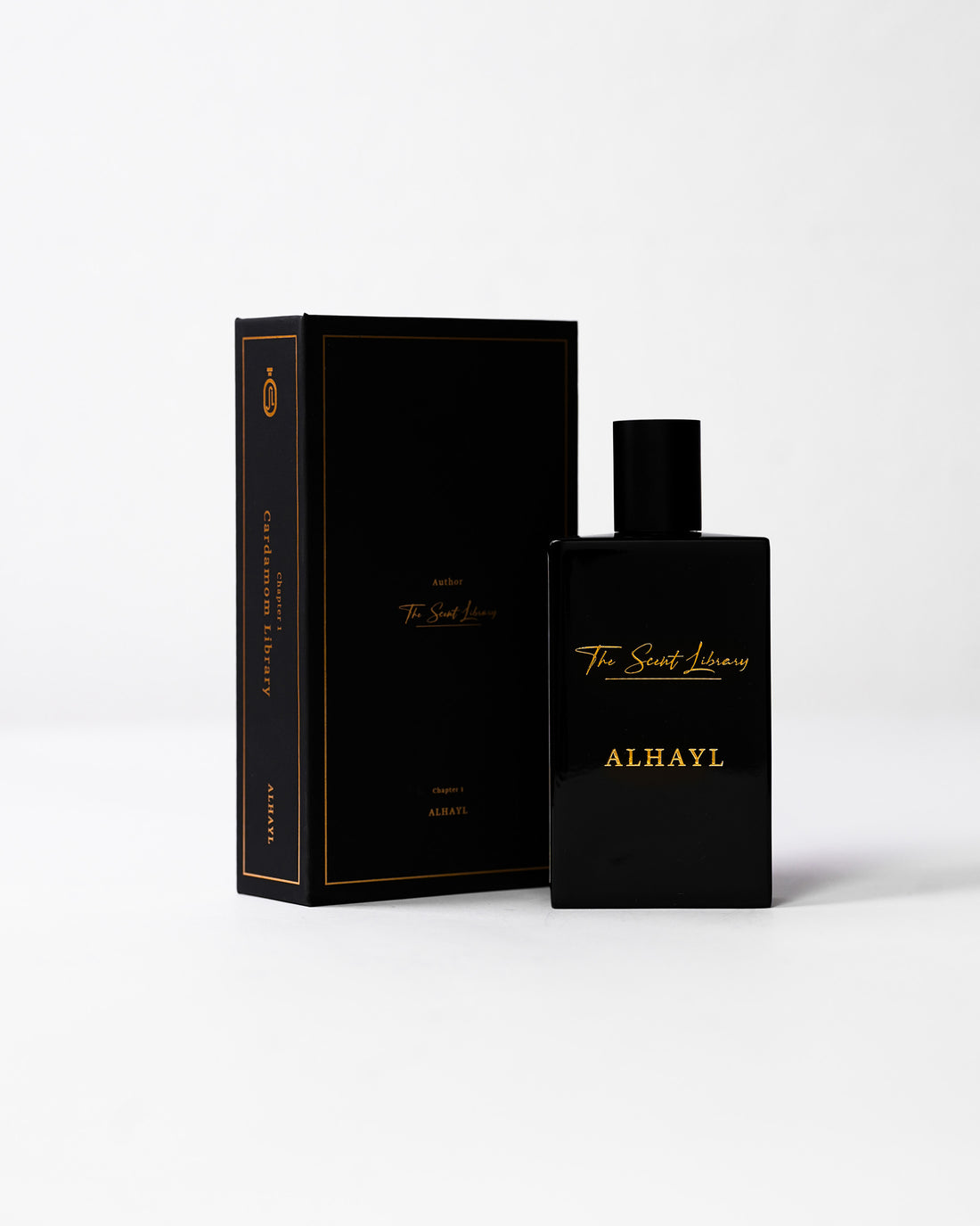 ALHAYL eau de parfum by The Scent Library, a glossy black rectangular bottle with gold lettering and a white Chapter 1 Cardamom Library side label
