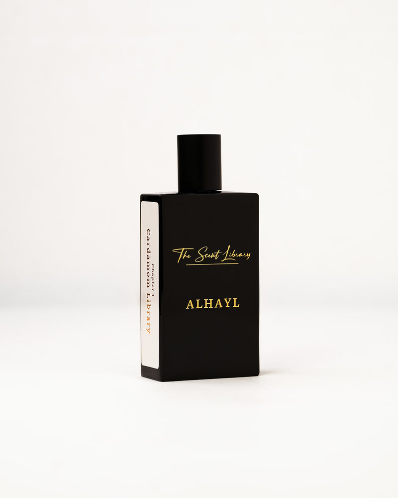 ALHAYL eau de parfum by The Scent Library, a glossy black rectangular bottle with gold lettering and a white Chapter 1 Cardamom Library side label