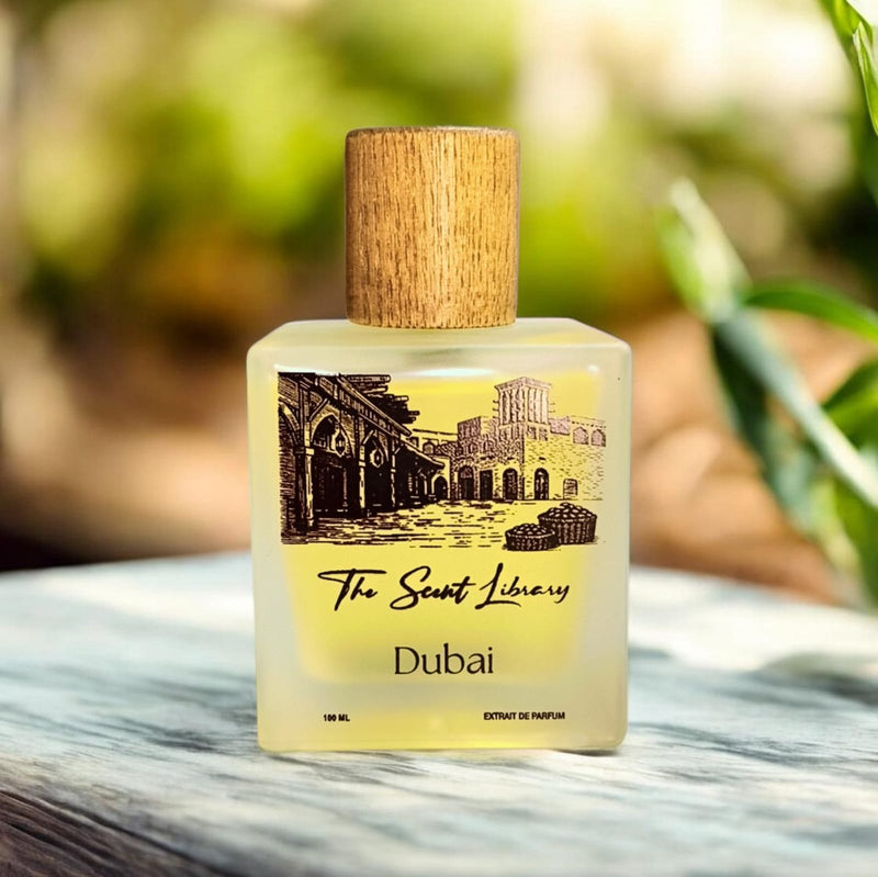 Dubai extrait de parfum by The Scent Library, a frosted glass bottle with a wooden cap and an illustrated label of old Dubai souk wind-tower architecture