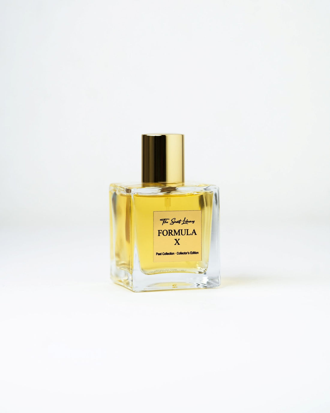 Formula X eau de parfum by The Scent Library, a clear square glass bottle with a gold cap and amber fragrance, Past Collection Collector's Edition