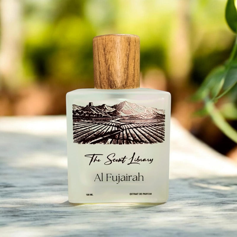 Al Fujairah extrait de parfum by The Scent Library, a frosted glass bottle with a wooden cap and an illustrated label of mountains and terraced fields