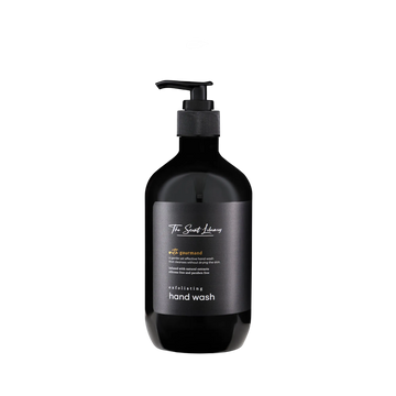 Sweet gourmand exfoliating hand wash by The Scent Library in a black pump bottle with a gold label