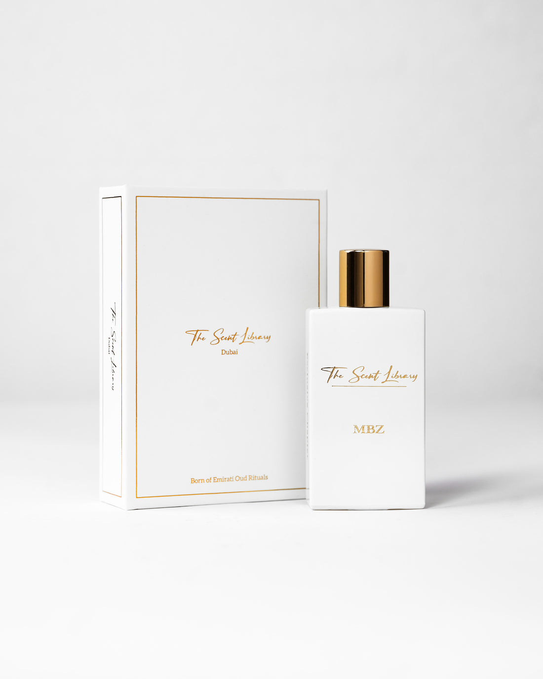 MBZ eau de parfum by The Scent Library, a white rectangular bottle with a gold cap beside its white book-style presentation box