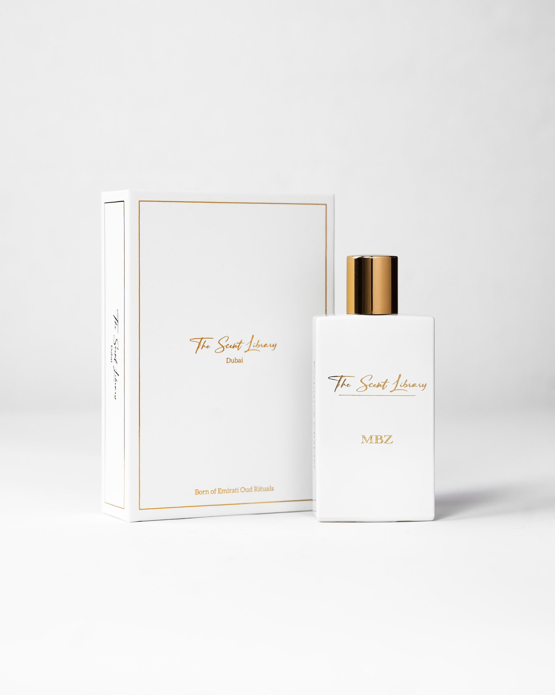 MBZ eau de parfum by The Scent Library, a white rectangular bottle with a gold cap beside its white book-style presentation box