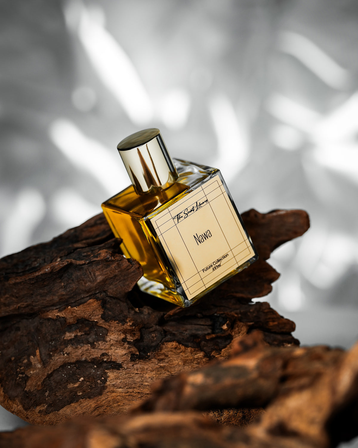Nawa perfume by The Scent Library, a clear square gold-capped glass bottle, Collector's Edition
