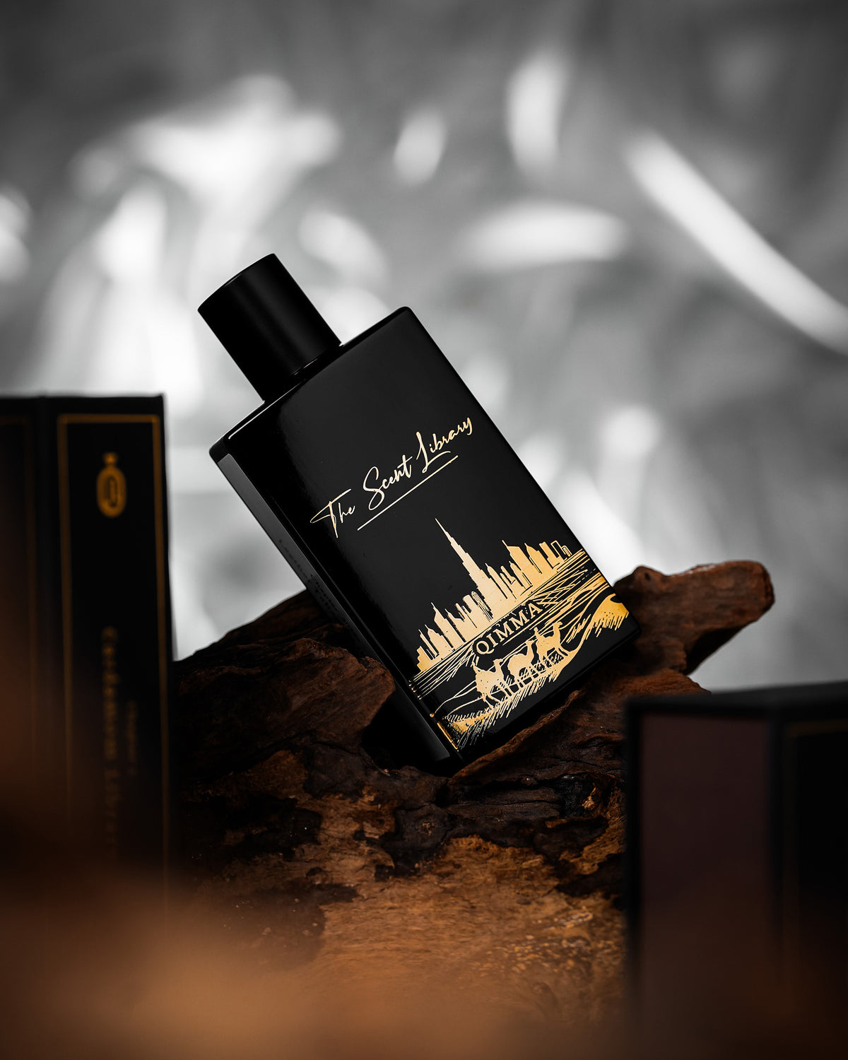 Qimma Collector's Edition by Julien Rasquinet at The Scent Library, a black bottle with gold skyline artwork, alternate view