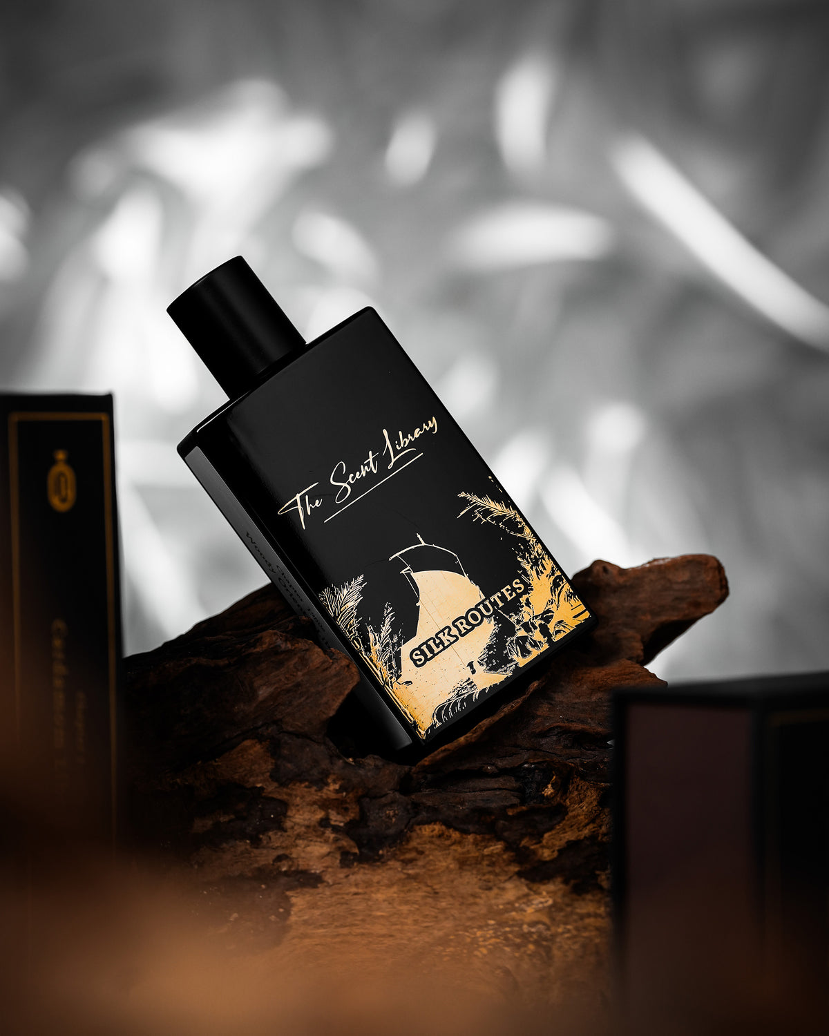 Silk Routes Collector's Edition by Kevin Mathys at The Scent Library, a black bottle with gold ship and palm artwork, alternate view