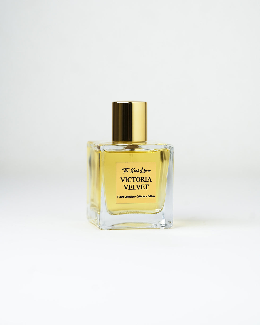 Victoria Velvet eau de parfum by The Scent Library, a clear square glass bottle with a gold cap and amber fragrance, Past Collection