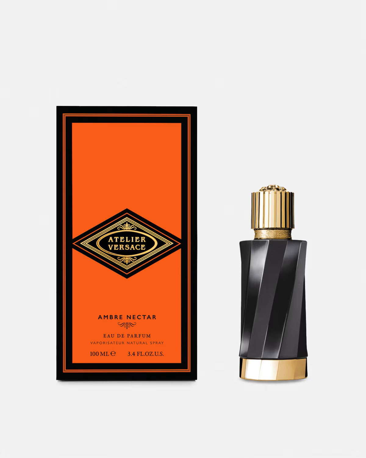 Versace Atelier Ambre Nectar perfume bottle with gold cap and black striped design beside orange and black packaging box