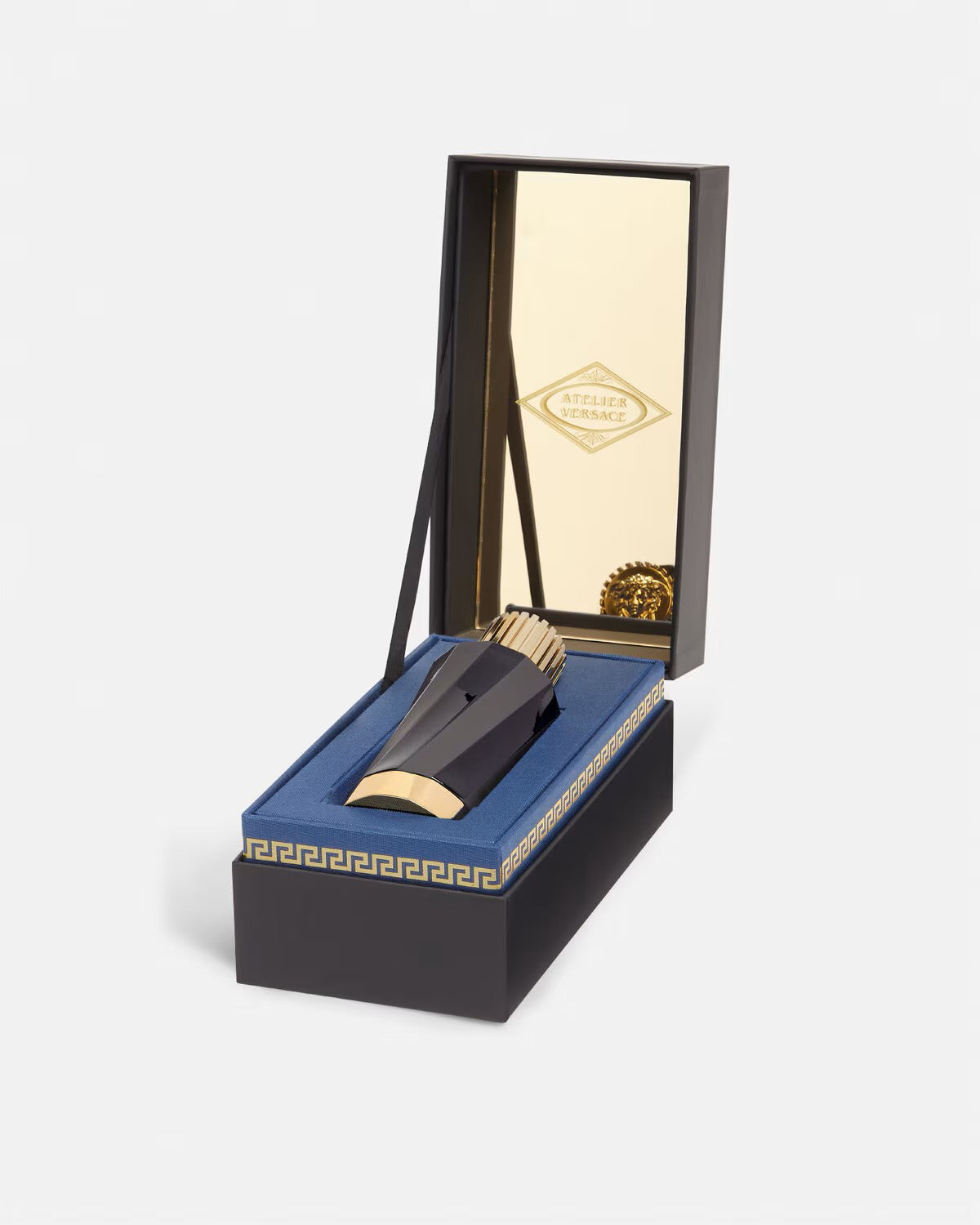 Versace Atelier Gingembre Petillant perfume bottle in a decorative black and gold box with blue interior