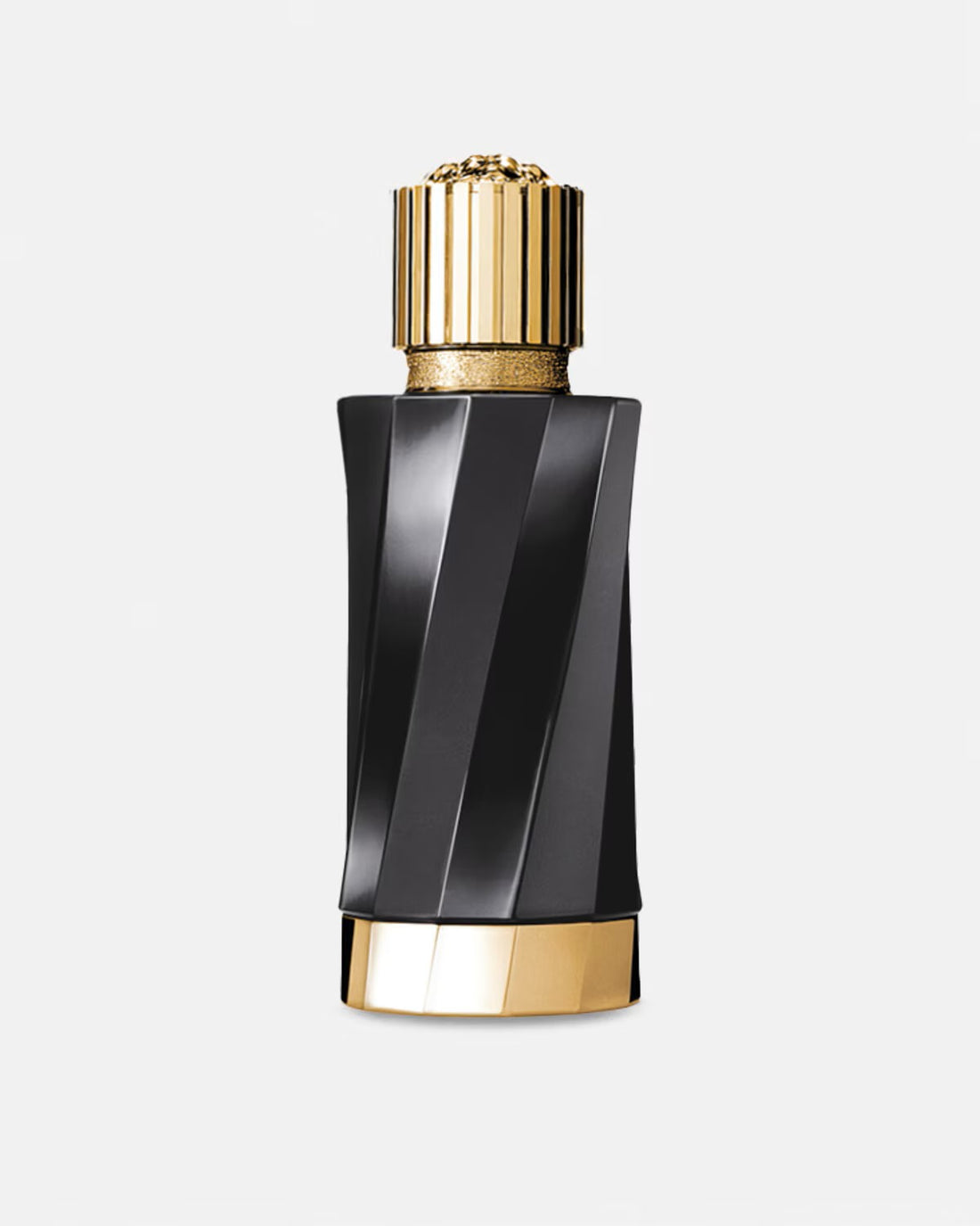 Versace Atelier Reve de Myrrhe perfume bottle with gold cap next to flowers and resin on white background