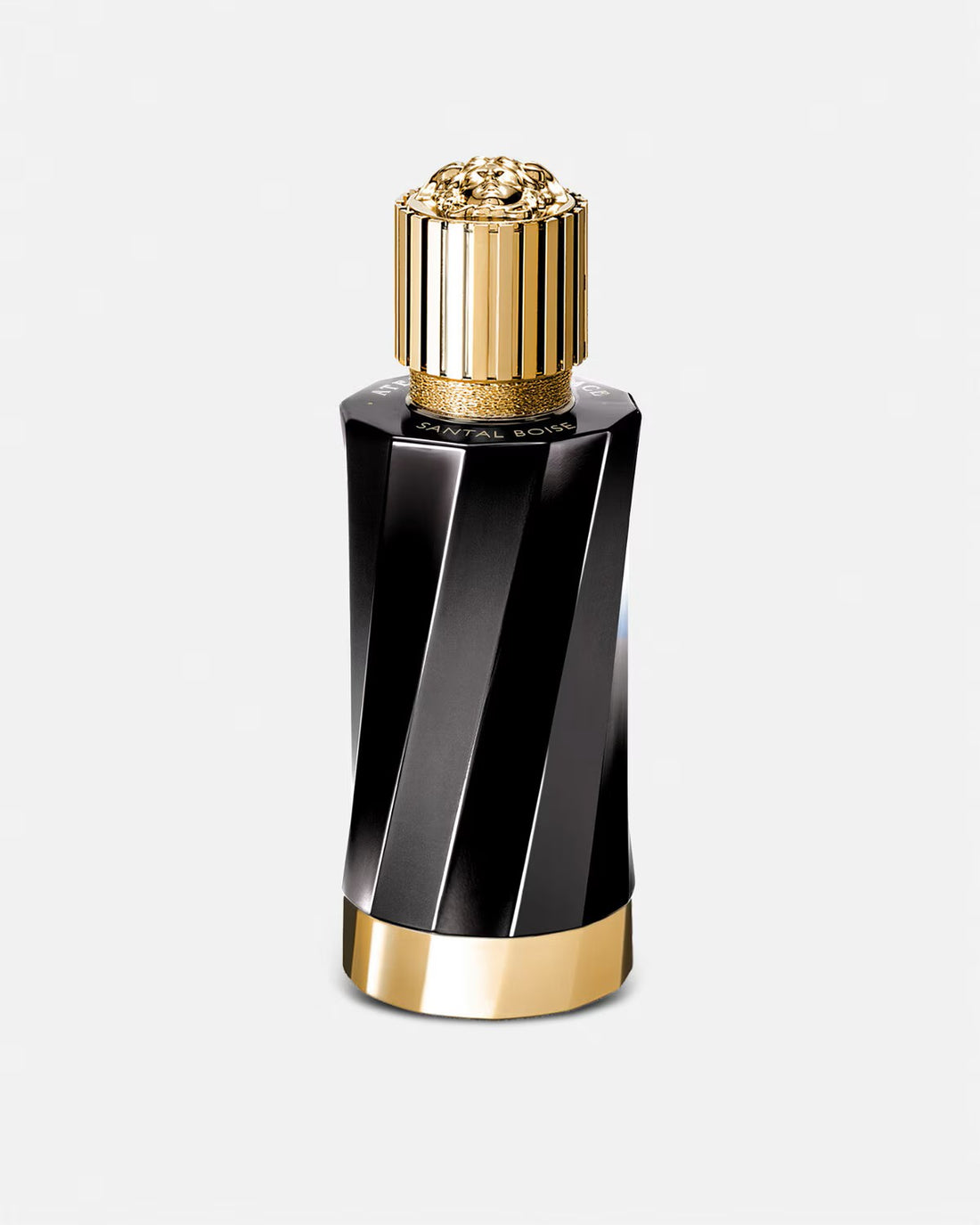 Versace Santal Boise Eau de Parfum black and gold bottle with sandalwood pieces on white background