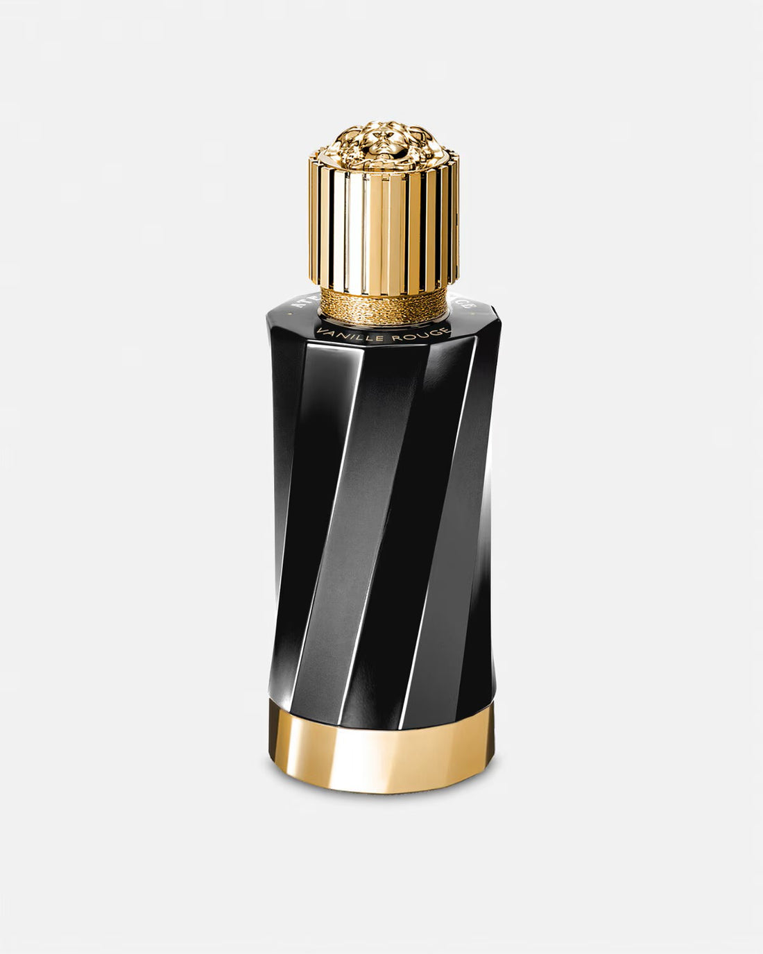 Versace Vanille Rouge perfume bottle with peach roses and vanilla bean on white background